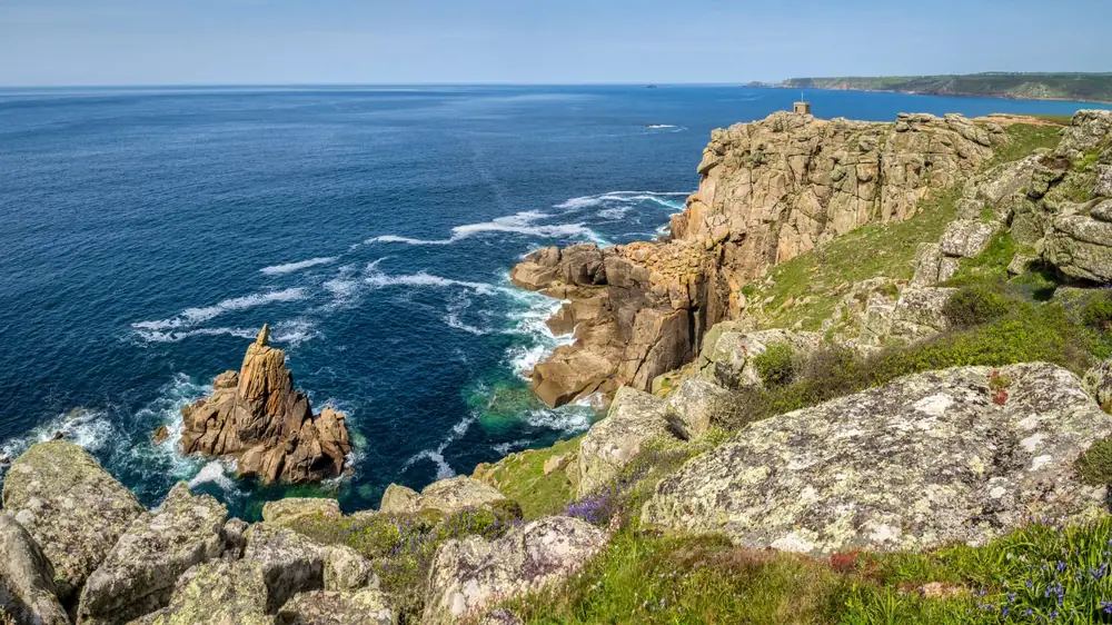 Granite cliffs and Atlantic surf on the west Cornwall coast near Sennen